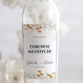Weselne naklejki na butelkę ze złocistą łąką
