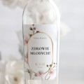 Weselne naklejki na butelkę z pastelowymi kwiatami i złotą ramką