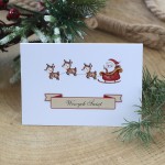 Wesołe kartki firmowe na Boże Narodzenie z mikołajem